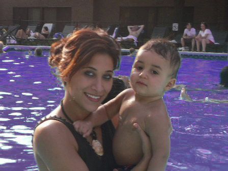 Mother and her son (who has epilepsy) In a purple pool for Purple Day for Epilepsy and Seizures.